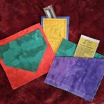 Three plain-colored iron-on pocket patches in various colors
